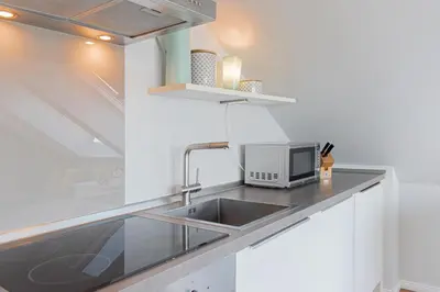 Küche/Küchenzeile in der Unterkunft Ferienwohnung STRANDraum