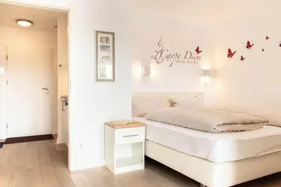 Ein Bett oder Betten in einem Zimmer der Unterkunft Ferienwohnung Viva La Vida