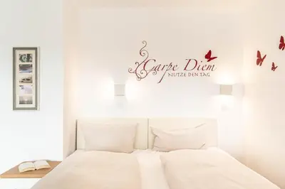 Ein Bett oder Betten in einem Zimmer der Unterkunft Ferienwohnung Viva La Vida