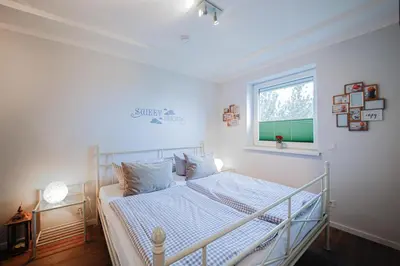 Ein Bett oder Betten in einem Zimmer der Unterkunft Ferienwohnung Traumland 1