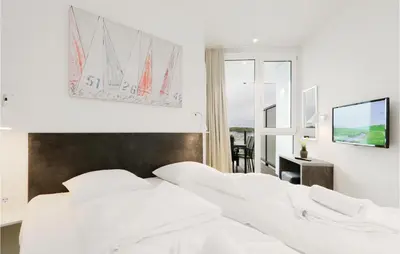 Ein Bett oder Betten in einem Zimmer der Unterkunft Highend Travemünde - Whg 506