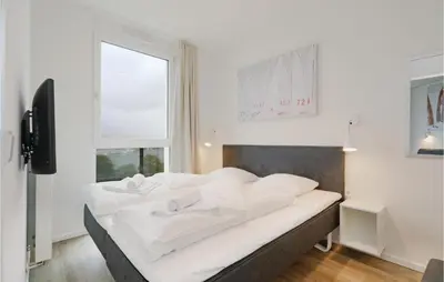 Ein Bett oder Betten in einem Zimmer der Unterkunft Highend Travemünde - Whg 610