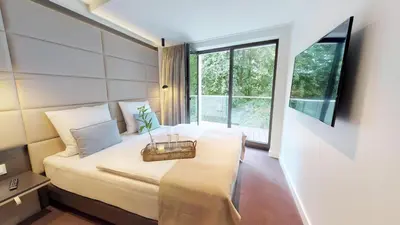 Ein Bett oder Betten in einem Zimmer der Unterkunft White Pearl Apartment 2.06