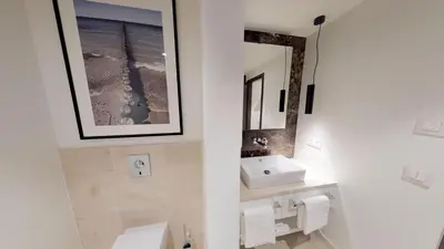 Ein Badezimmer in der Unterkunft White Pearl Apartment 1.11
