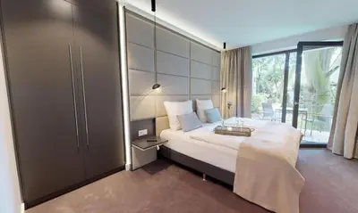 Ein Bett oder Betten in einem Zimmer der Unterkunft White Pearl Apartment 0.07