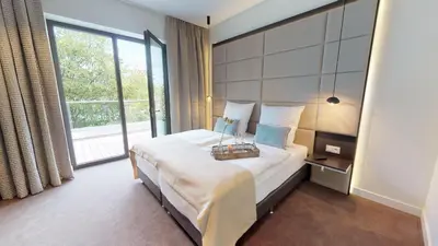 Ein Bett oder Betten in einem Zimmer der Unterkunft White Pearl Apartment 4 02