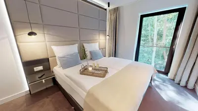 Ein Bett oder Betten in einem Zimmer der Unterkunft White Pearl Apartment 3.05