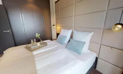 Ein Bett oder Betten in einem Zimmer der Unterkunft White Pearl Apartment 4 05
