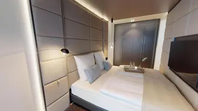 Ein Bett oder Betten in einem Zimmer der Unterkunft White Pearl Apartment 0.11