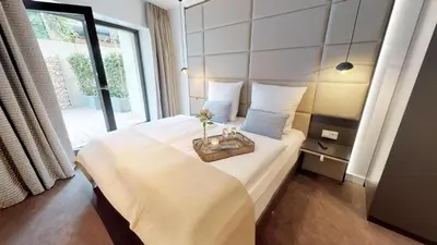 Ein Bett oder Betten in einem Zimmer der Unterkunft White Pearl Apartment 0.01