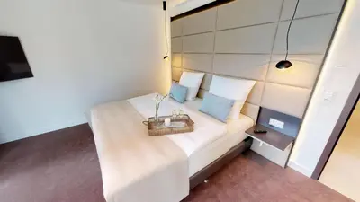 Ein Bett oder Betten in einem Zimmer der Unterkunft White Pearl Apartment 1.01