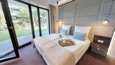 Ein Bett oder Betten in einem Zimmer der Unterkunft White Pearl Appartment 0.16