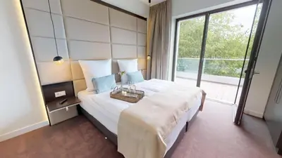 Ein Bett oder Betten in einem Zimmer der Unterkunft White Pearl Apartment 4.03