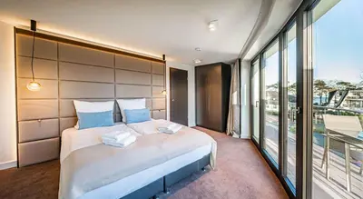 Ein Bett oder Betten in einem Zimmer der Unterkunft White Pearl Apartment 2.01