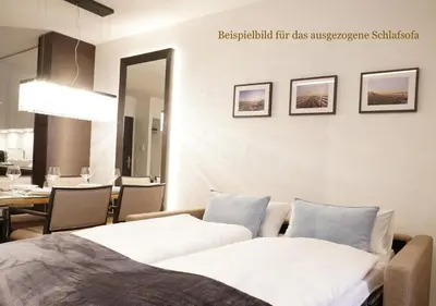 Ein Bett oder Betten in einem Zimmer der Unterkunft White Pearl Apartment 2.01