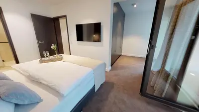 Ein Bett oder Betten in einem Zimmer der Unterkunft White Pearl Apartment 0.05