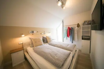 Ein Bett oder Betten in einem Zimmer der Unterkunft Ferienwohnung EAST COAST