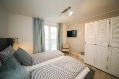 Ein Bett oder Betten in einem Zimmer der Unterkunft Ferienwohnung WEST COAST