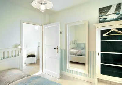 Ein Bett oder Betten in einem Zimmer der Unterkunft Meerhaus Niendorf