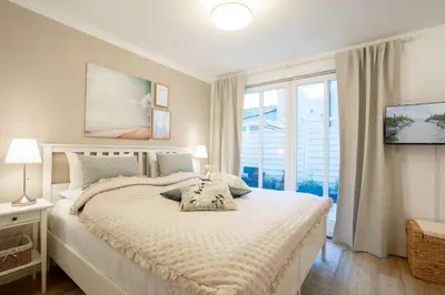 Ein Bett oder Betten in einem Zimmer der Unterkunft (ARW3) - Ferienwohnung Kossmann