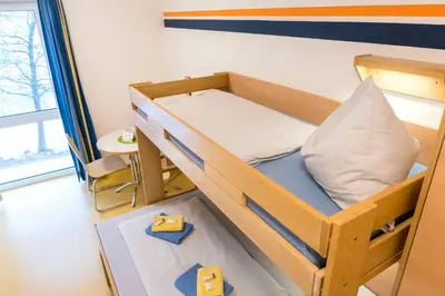 Ein Bett oder Betten in einem Zimmer der Unterkunft Jugendherberge Ratzeburg am See