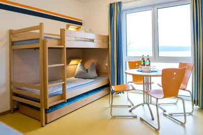 Ein Bett oder Betten in einem Zimmer der Unterkunft Jugendherberge Ratzeburg am See