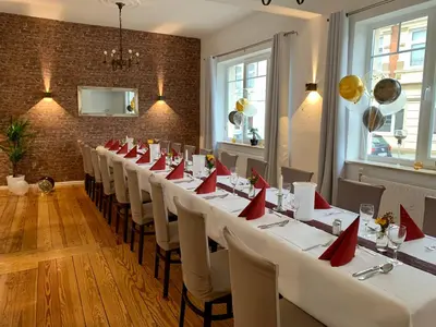 Ein Restaurant oder anderes Speiselokal in der Unterkunft Hotel Wiggers
