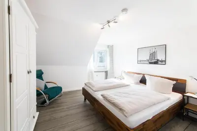 Ein Bett oder Betten in einem Zimmer der Unterkunft Ferienwohnung Viermaster