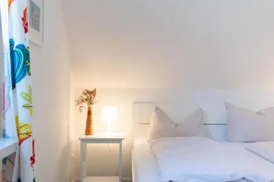 Ein Bett oder Betten in einem Zimmer der Unterkunft Ferienwohnung Viermaster