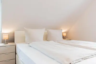 Ein Bett oder Betten in einem Zimmer der Unterkunft Ferienwohnung dat Seepeerdje