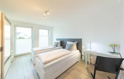 Ein Bett oder Betten in einem Zimmer der Unterkunft Ferienwohnung Ostseestern