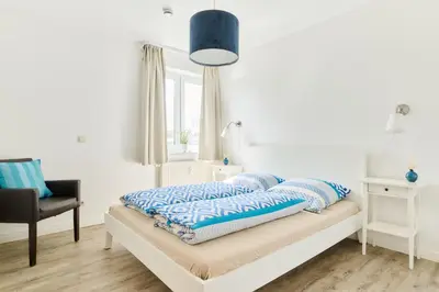 Ein Bett oder Betten in einem Zimmer der Unterkunft Ferienwohnung Bootsteg Moba-Travel