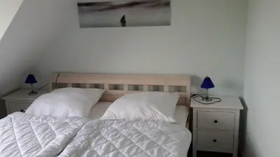 Ein Bett oder Betten in einem Zimmer der Unterkunft Am Pool und Strand 7 neu