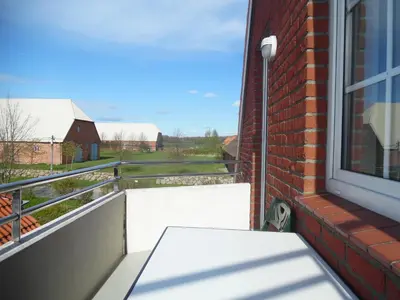 Ein Balkon oder eine Terrasse in der Unterkunft Am Pool und Strand 7 neu
