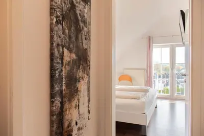 Ein Bett oder Betten in einem Zimmer der Unterkunft Ferienwohnung Wolkenfreude