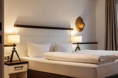 Ein Bett oder Betten in einem Zimmer der Unterkunft App Ostseestern