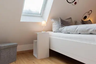 Ein Bett oder Betten in einem Zimmer der Unterkunft Ferienwohnung Nordlicht