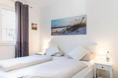Ein Bett oder Betten in einem Zimmer der Unterkunft Ferienwohnung Ostseetraum