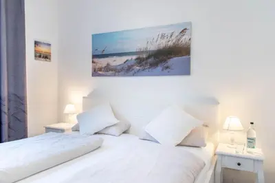 Ein Bett oder Betten in einem Zimmer der Unterkunft Ferienwohnung Ostseetraum