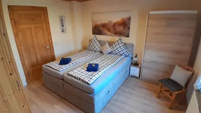 Ein Bett oder Betten in einem Zimmer der Unterkunft Ferienwohnung 