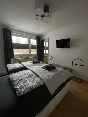 Ein Bett oder Betten in einem Zimmer der Unterkunft Ferienwohnung Juchmann *Zentrale/ strandnahe/ ruhige Lage*