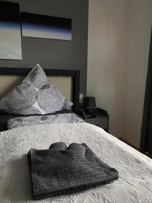 Ein Bett oder Betten in einem Zimmer der Unterkunft Ferienwohnung Juchmann *Zentrale/ strandnahe/ ruhige Lage*