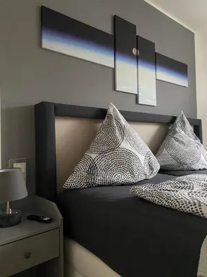 Ein Bett oder Betten in einem Zimmer der Unterkunft Ferienwohnung Juchmann *Zentrale/ strandnahe/ ruhige Lage*
