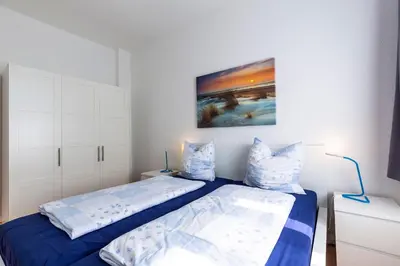 Ein Bett oder Betten in einem Zimmer der Unterkunft Haus Albatros Ferienwohnungen