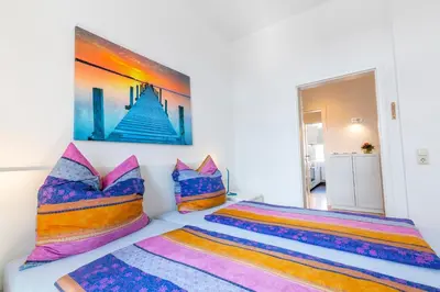 Ein Bett oder Betten in einem Zimmer der Unterkunft Haus Albatros Ferienwohnungen