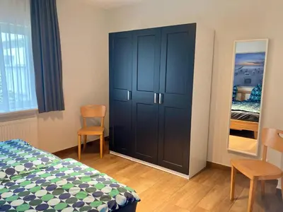 Ein Bett oder Betten in einem Zimmer der Unterkunft Haus Albatros Ferienwohnungen