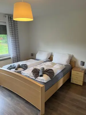 Ein Bett oder Betten in einem Zimmer der Unterkunft Ferienhaus Ahlers