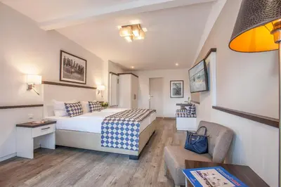 Ein Bett oder Betten in einem Zimmer der Unterkunft Strandgrün Golf- & Spa Resort