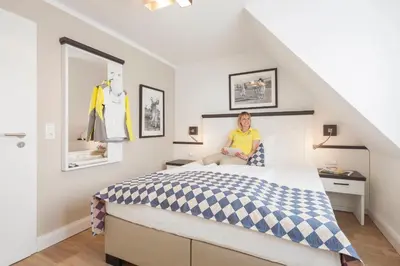 Ein Bett oder Betten in einem Zimmer der Unterkunft Strandgrün Golf- & Spa Resort