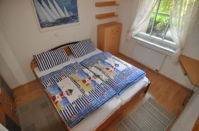 Ein Bett oder Betten in einem Zimmer der Unterkunft FeWo ostseele - Sunny